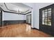 Formal dining room with hardwood floors, a chandelier, and views of the front yard at 120 Daniel Creek Ln, Sugar Hill, GA 30518