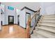 Bright foyer with hardwood floors, staircase and lots of natural light at 120 Daniel Creek Ln, Sugar Hill, GA 30518