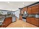 Kitchen featuring wood cabinets, stainless steel appliances, and granite countertops at 120 Daniel Creek Ln, Sugar Hill, GA 30518