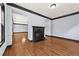 Living room featuring hardwood floors and a granite fireplace at 120 Daniel Creek Ln, Sugar Hill, GA 30518