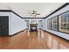 Bright living room with a fireplace, hardwood floors, and large windows at 120 Daniel Creek Ln, Sugar Hill, GA 30518