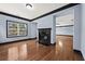 Living room with a granite fireplace and large windows at 120 Daniel Creek Ln, Sugar Hill, GA 30518