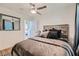 Comfortable bedroom featuring stylish furnishings, wood-look floors, and a ceiling fan at 1801 Beecher Sw St, Atlanta, GA 30310