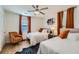 Inviting bedroom featuring two beds, hardwood flooring, and natural light from the windows at 1801 Beecher Sw St, Atlanta, GA 30310