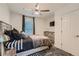 Stylish bedroom with a modern ceiling fan, neutral color scheme, and a decorative rug at 1801 Beecher Sw St, Atlanta, GA 30310