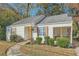 Street view of a cozy home with a quaint front yard and inviting screened porch at 1801 Beecher Sw St, Atlanta, GA 30310