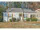 Charming single-story home featuring a quaint front yard and a cozy screened-in porch at 1801 Beecher Sw St, Atlanta, GA 30310