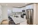 Kitchen with white cabinetry, stainless steel appliances, and granite countertops at 1801 Beecher Sw St, Atlanta, GA 30310