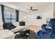 Comfortable living room featuring a white couch, stylish chairs, and a ceiling fan at 1801 Beecher Sw St, Atlanta, GA 30310