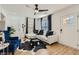 Airy living room featuring wood floors, a white couch, and a ceiling fan at 1801 Beecher Sw St, Atlanta, GA 30310