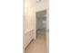 Bathroom featuring a vanity with doorway to a bedroom with large window at 2474 Starfire Ln, Loganville, GA 30052