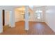 Elegant foyer with hardwood floors, chandelier, and view of the front door at 2474 Starfire Ln, Loganville, GA 30052