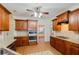 Well-equipped kitchen featuring granite countertops, stainless steel appliances, and custom cabinetry at 2474 Starfire Ln, Loganville, GA 30052