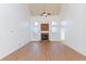 Open-concept living room with tall ceilings, fireplace, and hardwood floors at 2474 Starfire Ln, Loganville, GA 30052