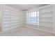 Cozy office space with custom built-in bookshelves and a window seat for reading at 2474 Starfire Ln, Loganville, GA 30052
