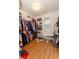 Large walk-in closet with custom shelving provides ample storage space at 2474 Starfire Ln, Loganville, GA 30052