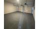 Two car garage with a light gray epoxy floor and two white doors at 2878 Belfaire Lake Dr, Dacula, GA 30019