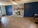 Spacious living room with a brick fireplace, wood mantel, and paneled walls at 420 Lee Dr, Acworth, GA 30102