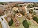 Aerial view of the home surrounded by green pastures, fenced yard and mature trees, offering privacy and space at 504 Leguin Mill Rd, Locust Grove, GA 30248