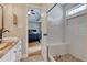 Bathroom featuring vanity with double sinks and a tiled walk-in shower at 504 Leguin Mill Rd, Locust Grove, GA 30248