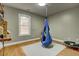 Bedroom featuring hardwood flooring and hanging chair at 504 Leguin Mill Rd, Locust Grove, GA 30248