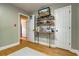 Bedroom with hardwood floors, and built-in shelving at 504 Leguin Mill Rd, Locust Grove, GA 30248