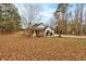 Charming single-story home featuring a well-manicured lawn and a cozy front porch with traditional design elements at 504 Leguin Mill Rd, Locust Grove, GA 30248