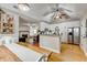 Open kitchen featuring white cabinetry, stainless steel appliances, and hardwood flooring at 504 Leguin Mill Rd, Locust Grove, GA 30248