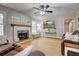 Comfortable living room showcasing a fireplace, hardwood floors, and ample natural light for a cozy and inviting atmosphere at 504 Leguin Mill Rd, Locust Grove, GA 30248