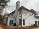 Backyard featuring a patio area and exterior of the two-story home at 6910 Stone Breeze Dr, Stone Mountain, GA 30087