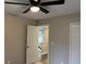 This bedroom's design features neutral-colored walls and trim, complemented by the ceiling fan for added comfort at 6910 Stone Breeze Dr, Stone Mountain, GA 30087