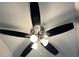 A stylish ceiling fan is featured with dark blades and multiple lights, enhancing the room's decor and comfort at 6910 Stone Breeze Dr, Stone Mountain, GA 30087