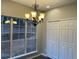 Dining area bathed in natural light with view of the backyard at 6910 Stone Breeze Dr, Stone Mountain, GA 30087