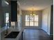 Eat-in kitchen with modern gray countertops, faucet, and ample natural light at 6910 Stone Breeze Dr, Stone Mountain, GA 30087