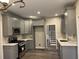 Well-designed kitchen with gray cabinets, modern stainless steel appliances, and lots of counter space for cooking at 6910 Stone Breeze Dr, Stone Mountain, GA 30087