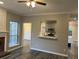 Open-concept living room with hardwood floors and view into the kitchen at 6910 Stone Breeze Dr, Stone Mountain, GA 30087