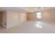 Spacious finished basement with neutral carpet and double-door closet at 814 Oak Moss Dr, Lawrenceville, GA 30043