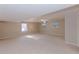 Large finished basement with neutral carpet, natural light and recessed lighting at 814 Oak Moss Dr, Lawrenceville, GA 30043