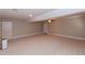 Open finished basement with neutral carpet and lighting at 814 Oak Moss Dr, Lawrenceville, GA 30043