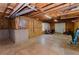 Unfinished basement with concrete floor and exposed ceiling with insulation along wall at 814 Oak Moss Dr, Lawrenceville, GA 30043