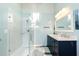 Bright bathroom with double vanity, walk-in shower, and modern fixtures at 814 Oak Moss Dr, Lawrenceville, GA 30043