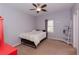 Cozy bedroom with soft carpet, light grey walls, and built-in shelving at 814 Oak Moss Dr, Lawrenceville, GA 30043