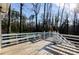 Spacious wooden deck featuring built-in bench seating and wooded views at 814 Oak Moss Dr, Lawrenceville, GA 30043