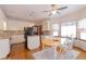 Bright kitchen with white cabinetry, tile backsplash, and breakfast nook with lots of natural light at 814 Oak Moss Dr, Lawrenceville, GA 30043