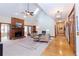 Spacious living room featuring a brick fireplace, hardwood floors and a sky light at 814 Oak Moss Dr, Lawrenceville, GA 30043