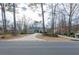 Picture of a lovely home, flanked by beautiful trees and a well maintained lawn at 814 Oak Moss Dr, Lawrenceville, GA 30043