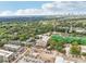 Overhead view of a mixed-use building with cityscape and mature trees in the background at 112 Rogers Ne St # 206, Atlanta, GA 30317