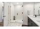 A modern bathroom with a glass shower, double vanity, and sleek fixtures, offering a spa-like experience at 112 Rogers Ne St # 206, Atlanta, GA 30317