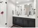 Bathroom with double vanity, modern fixtures, and a glass-enclosed shower, providing a luxurious experience at 112 Rogers Ne St # 206, Atlanta, GA 30317