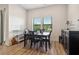 Bright dining area featuring a modern table and chairs, and a decorative buffet cabinet at 112 Rogers Ne St # 206, Atlanta, GA 30317